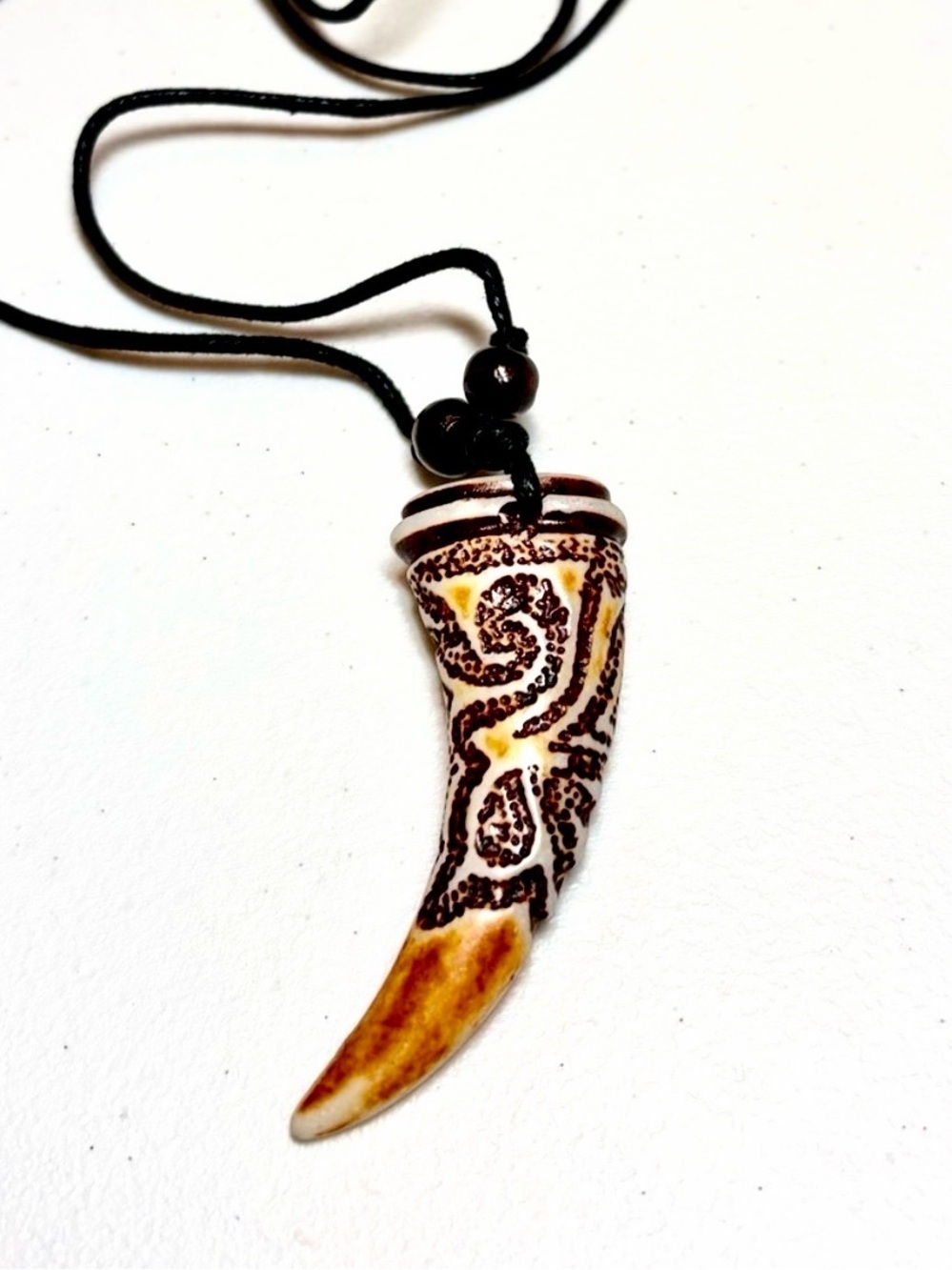 Carved Horn Pendant Necklace in Brown and Cream.